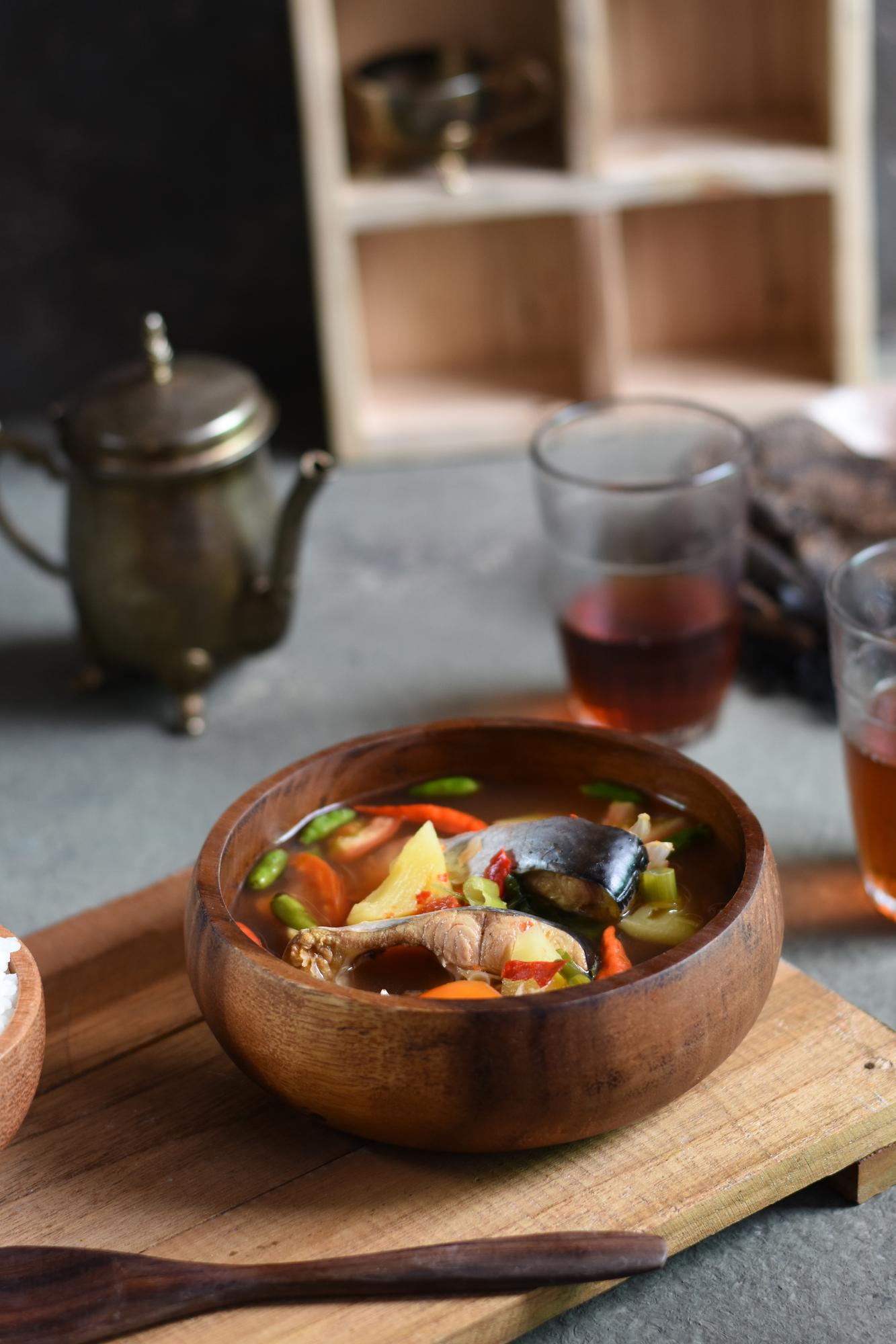 Bowl of regional stew on a dark table